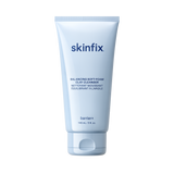 Skinfix Balancing Soft-Foam Clay Cleanser tube, 148 mL, in light blue packaging with navy text, on a transparent background.