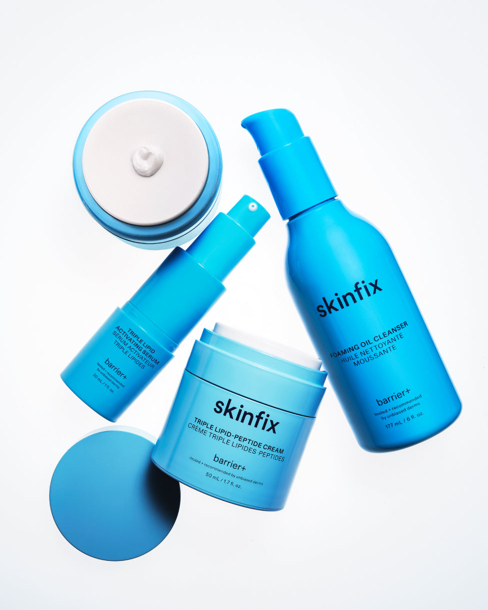 Skinfix Triple Lipid-Peptide Cream, Foaming Oil Cleanser and Triple Lipid Activating Serum laying on white background.