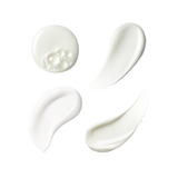 Four swatches of thick, creamy white cosmetic product, including one with visible bubbles, arranged on a plain white background.
