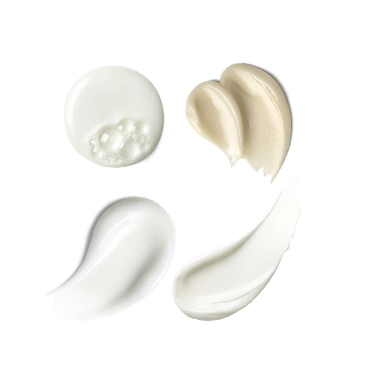 Four swatches of skincare: Hydrating Foaming Oil Cleanser, Exo + Ectoin Intensive Repair Baume, Triple Lipid Eye Treatment and Triple Lipid-Peptide Cream  showing product's texture on transparent background.