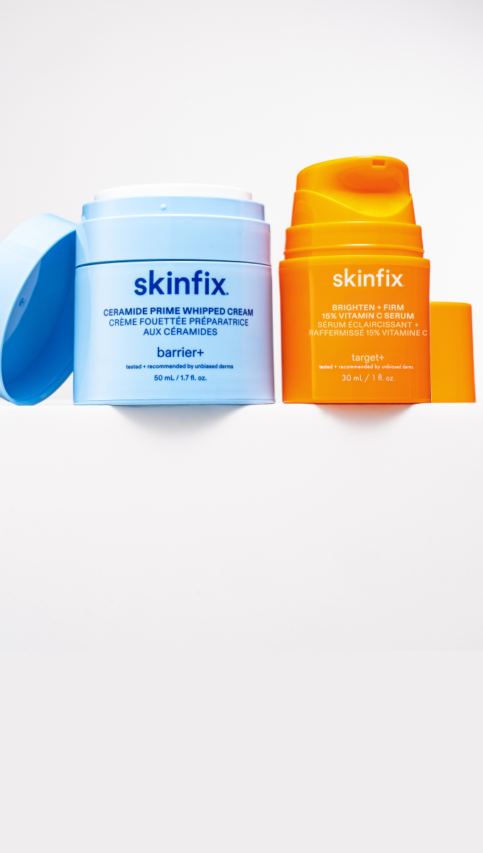 Skinfix Ceramide Prime Whipped Cream in light blue packaging with the lid open, and Brighten + Firm 15% Vitamin C Serum in orange packaging, on a white shelf.