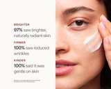 Close-up of a person applying cream to their cheek with on-image clinical claims about brighter-looking skin, reduced wrinkles, and gentle results.