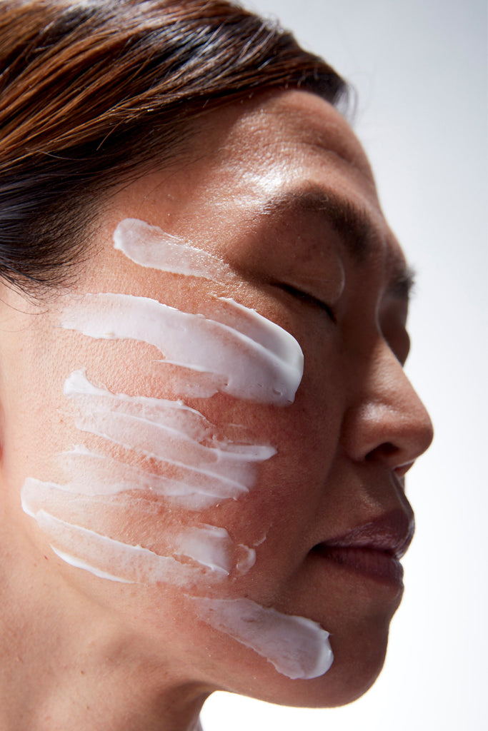 woman with moisturizer on her face